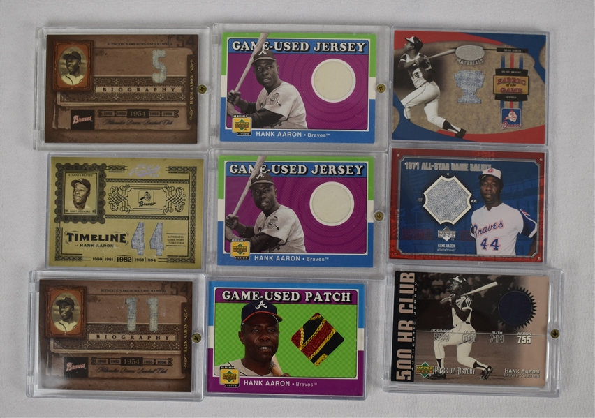 Hank Aaron Collection of 9 Game Used Jersey Cards 