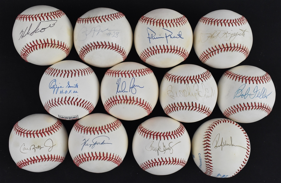 Lot of 12 Autographed Baseballs w/Cal Ripken Jr. Nolan Ryan Roger Clemens & Rickey Henderson